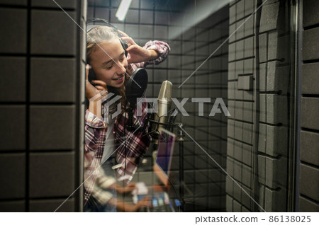 Singer enjoying the process of recording a song 86138025