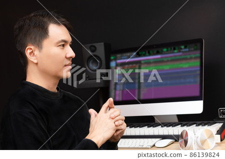 asian professional music producer, composer, songwriter, artist with computer and recording equipment in home studio. music production concept asian professional music producer, composer, songwriter, artist with computer and recording equipment in home studio. music production concept 86139824