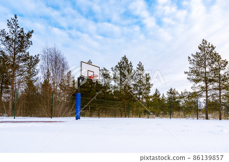 Basketball field covered with snow 86139857