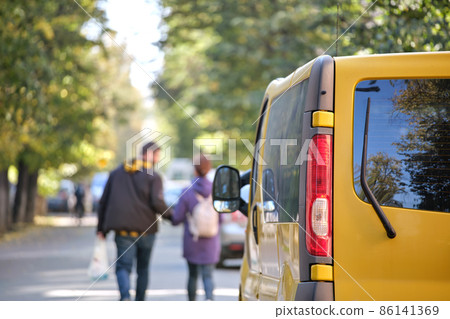 Close up of a car parked illegally against traffic rules on pedestrian city street side 86141369