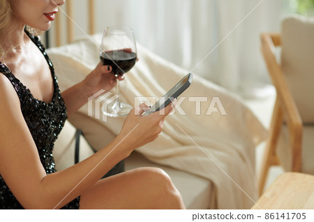 Woman Drinking and Texting Woman Drinking and Texting 86141705