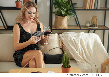 Elegant Woman Checking Phone Elegant Woman Checking Phone 86141706