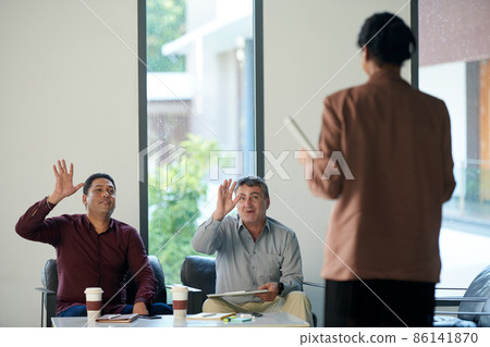 Business People Greeting Colleague 86141870