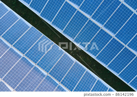 Aerial view building roof with rows of blue solar photovoltaic panels for producing clean ecological electric energy. Renewable electricity with zero emission concept Aerial view building roof with rows of blue solar photovoltaic panels for producing clean ecological electric energy. Renewable electricity with zero emission concept 86142196