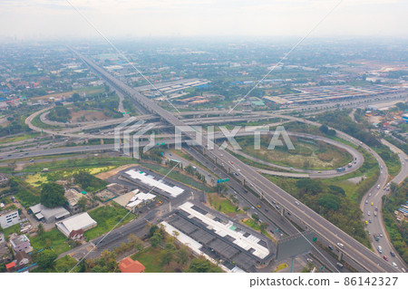 Aerial view of cars driving on highway or moterway. Overpass bridge street roads in connection network of architecture concept. Top view. Urban city, Bangkok, Thailand. 86142327