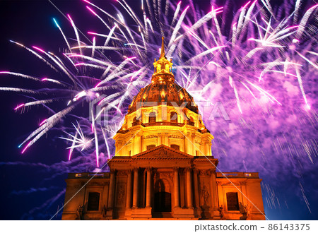 Celebratory colorful fireworks over the Les Invalides (The National Residence of the Invalids) at night. Paris, France Celebratory colorful fireworks over the Les Invalides (The National Residence of the Invalids) at night. Paris, France 86143375