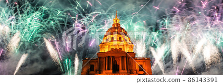 Celebratory colorful fireworks over the Les Invalides (The National Residence of the Invalids) at night. Paris, France Celebratory colorful fireworks over the Les Invalides (The National Residence of the Invalids) at night. Paris, France 86143391