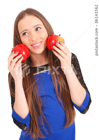 Young girl holds near the face apples 86143562