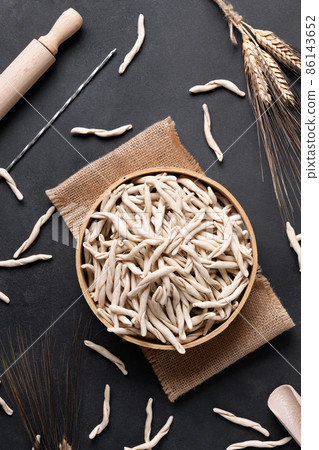 Fresh maccheroni typical dish of Puglia Salento Italy. Italian homemade pasta background, top view 86143652