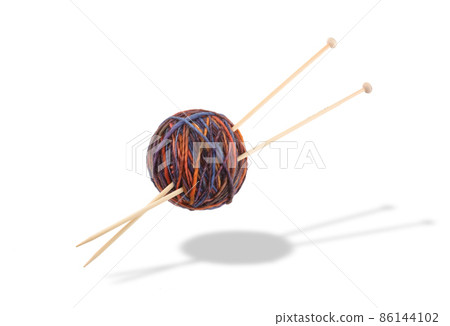 Knitting needles and ball of wool yarn with drop shadow Knitting needles and ball of wool yarn with drop shadow 86144102