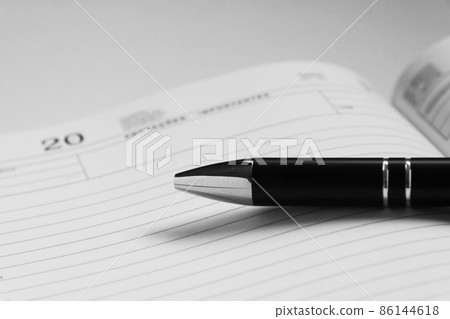 Calendar notebook and pen monochrome Calendar notebook and pen monochrome 86144618