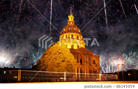 Celebratory colorful fireworks over the Les Invalides (The National Residence of the Invalids) at night. Paris, France Celebratory colorful fireworks over the Les Invalides (The National Residence of the Invalids) at night. Paris, France 86145054