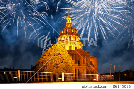 Celebratory colorful fireworks over the Les Invalides (The National Residence of the Invalids) at night. Paris, France Celebratory colorful fireworks over the Les Invalides (The National Residence of the Invalids) at night. Paris, France 86145056