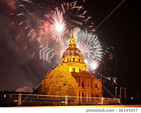 Celebratory colorful fireworks over the Les Invalides (The National Residence of the Invalids) at night. Paris, France Celebratory colorful fireworks over the Les Invalides (The National Residence of the Invalids) at night. Paris, France 86145057