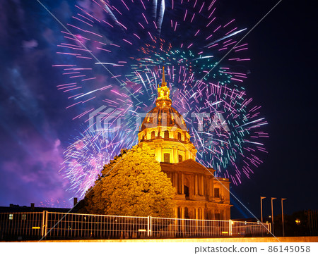Celebratory colorful fireworks over the Les Invalides (The National Residence of the Invalids) at night. Paris, France Celebratory colorful fireworks over the Les Invalides (The National Residence of the Invalids) at night. Paris, France 86145058
