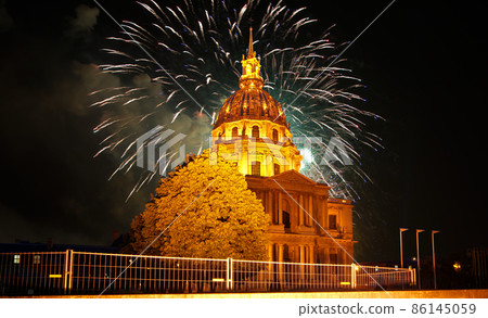 Celebratory colorful fireworks over the Les Invalides (The National Residence of the Invalids) at night. Paris, France Celebratory colorful fireworks over the Les Invalides (The National Residence of the Invalids) at night. Paris, France 86145059