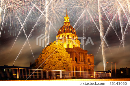 Celebratory colorful fireworks over the Les Invalides (The National Residence of the Invalids) at night. Paris, France Celebratory colorful fireworks over the Les Invalides (The National Residence of the Invalids) at night. Paris, France 86145060