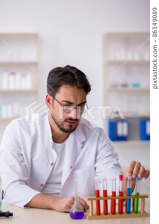 Young male chemist working at the lab Young male chemist working at the lab 86149089