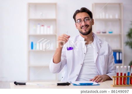 Young male chemist working at the lab Young male chemist working at the lab 86149097