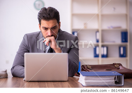 Young businessman employee working in the office Young businessman employee working in the office 86149647
