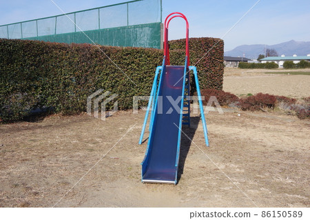 The front of the slide in the park 86150589