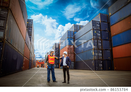 Manager and dock worker under discussion said hello in new normal concept dock container shipping warehouse ,they wearing safety uniform hard hat and medical mask for protect virus. Manager and dock worker under discussion said hello in new normal concept dock container shipping warehouse ,they wearing safety uniform hard hat and medical mask for protect virus. 86153784
