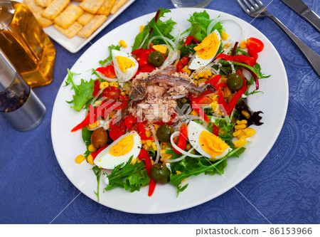 Just cooked fresh lettuce, anchovy, egg salad Just cooked fresh lettuce, anchovy, egg salad 86153966