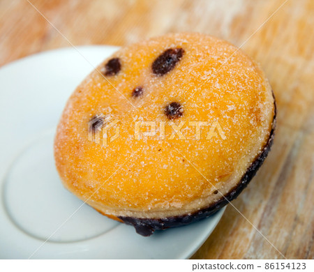 Berliner, German donut with chocolate filling Berliner, German donut with chocolate filling 86154123