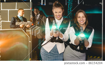 Two women having corporative entertainment 86154204