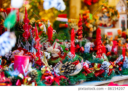 Christmas decorations with candles at outdoors market Christmas decorations with candles at outdoors market 86154207