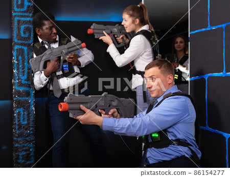 men and women co-workers having corporate entertainment men and women co-workers having corporate entertainment 86154277