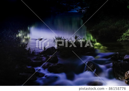 It is a quiet night of the Takiyama River Gorge and the scenery of fireflies. You can feel the silence. Hiroshima 86158776