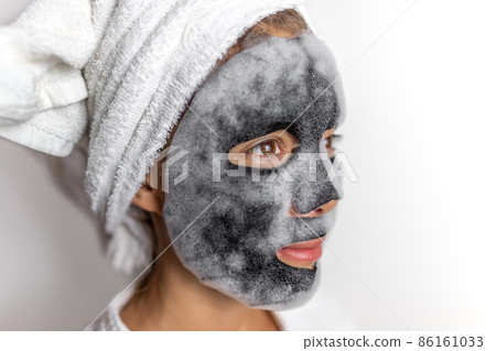 Face mask foam bubbles detox facial treatment at home -asian girl purifying skin with chemical peel korean product in bathroom Face mask foam bubbles detox facial treatment at home -asian girl purifying skin with chemical peel korean product in bathroom 86161033