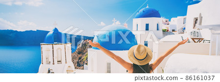 Happy summer fun woman enjoying sun on Europe holiday, Greece travel destination, Oia Santorini banner panorama. Tourist at the three blue domes 86161037