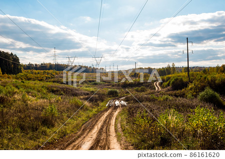 Dirt country road under power line Dirt country road under power line 86161620