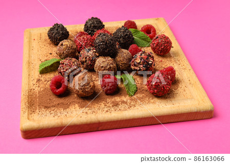 Concept of sweets with chocolate candies on pink background 86163066