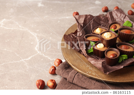 Concept of sweets with chocolate candies on textured background 86163115