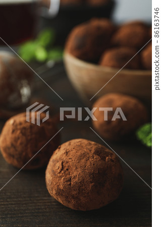 Concept of sweets with truffles on dark wooden background 86163746
