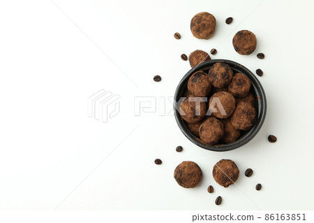 Concept of sweets with truffles on white background Concept of sweets with truffles on white background 86163851