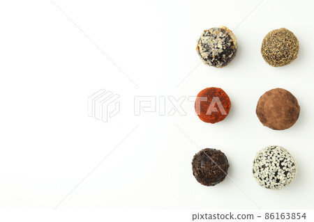 Flat lay composition with truffles on white background Flat lay composition with truffles on white background 86163854