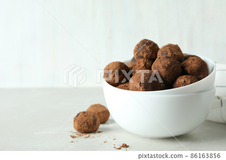 Concept of sweets with truffles on white background Concept of sweets with truffles on white background 86163856