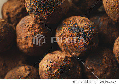Sweet truffles all over background, close up Sweet truffles all over background, close up 86163857
