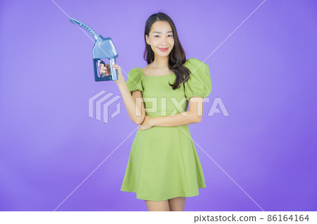 Portrait beautiful young asian woman feul gas pump Portrait beautiful young asian woman feul gas pump 86164164
