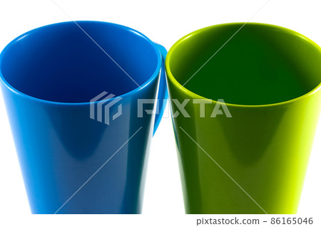 Green and blue cup isolate on white background 86165046