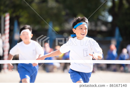 Elementary school boy who wins the first prize in a foot race Elementary school boy who wins the first prize in a foot race 86167140