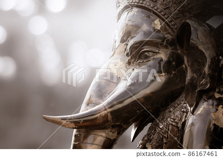 Close-up horizontal view of broken face of statue Ganesha is god of Hindu which one of the best-known and most worshipped deities in the Hindu pantheon. Close-up horizontal view of broken face of statue Ganesha is god of Hindu which one of the best-known and most worshipped deities in the Hindu pantheon. 86167461