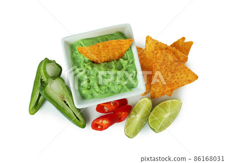 Tasty concept with chips and guacamole isolated on white background Tasty concept with chips and guacamole isolated on white background 86168031