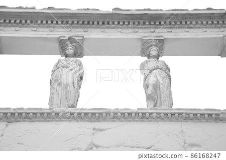 The Caryatid porch of the Erechtheion Temple in Athens isolated on white background with clipping path 86168247