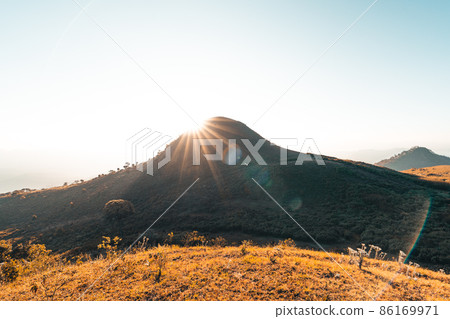 morning light and mountains,mountains in summer morning and spring flowers 86169971