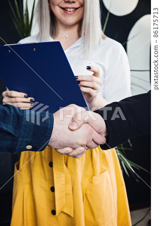 Businessmen People in informal casual clothes shaking hands. Client or customer and business owner agreement, business partner, Cooperation concept. Businessmen People in informal casual clothes shaking hands. Client or customer and business owner agreement, business partner, Cooperation concept. 86175713
